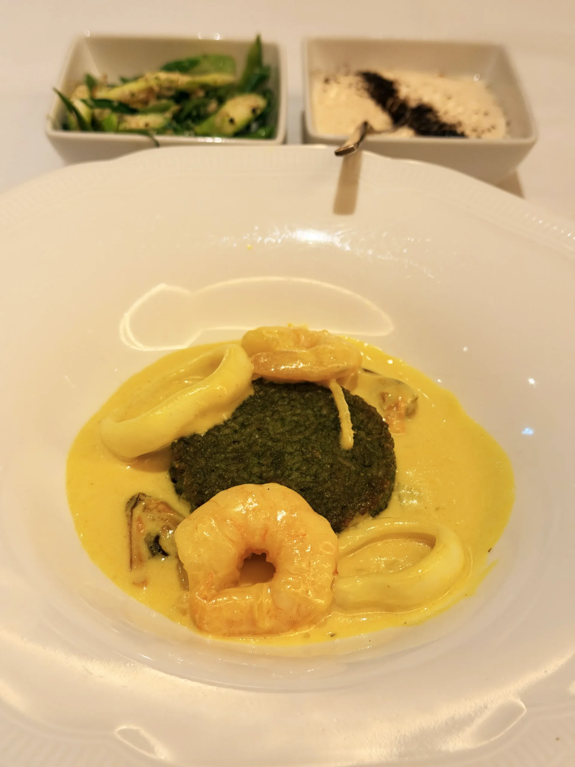 Aromatic basmati rice cooked with mussels, squid, prawns, herbs, spices, asparagus, and grated coconut at Quilon London.
