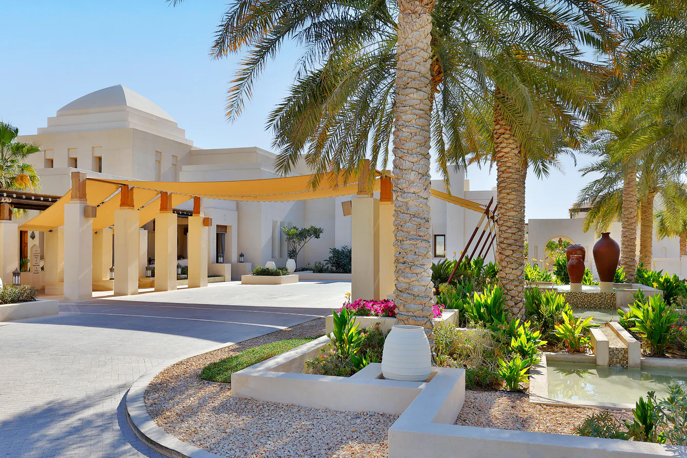 Intricate traditional architecture and village-inspired courtyard design at Al Wathba, a Luxury Collection Desert Resort & Spa, reflecting authentic desert heritage.