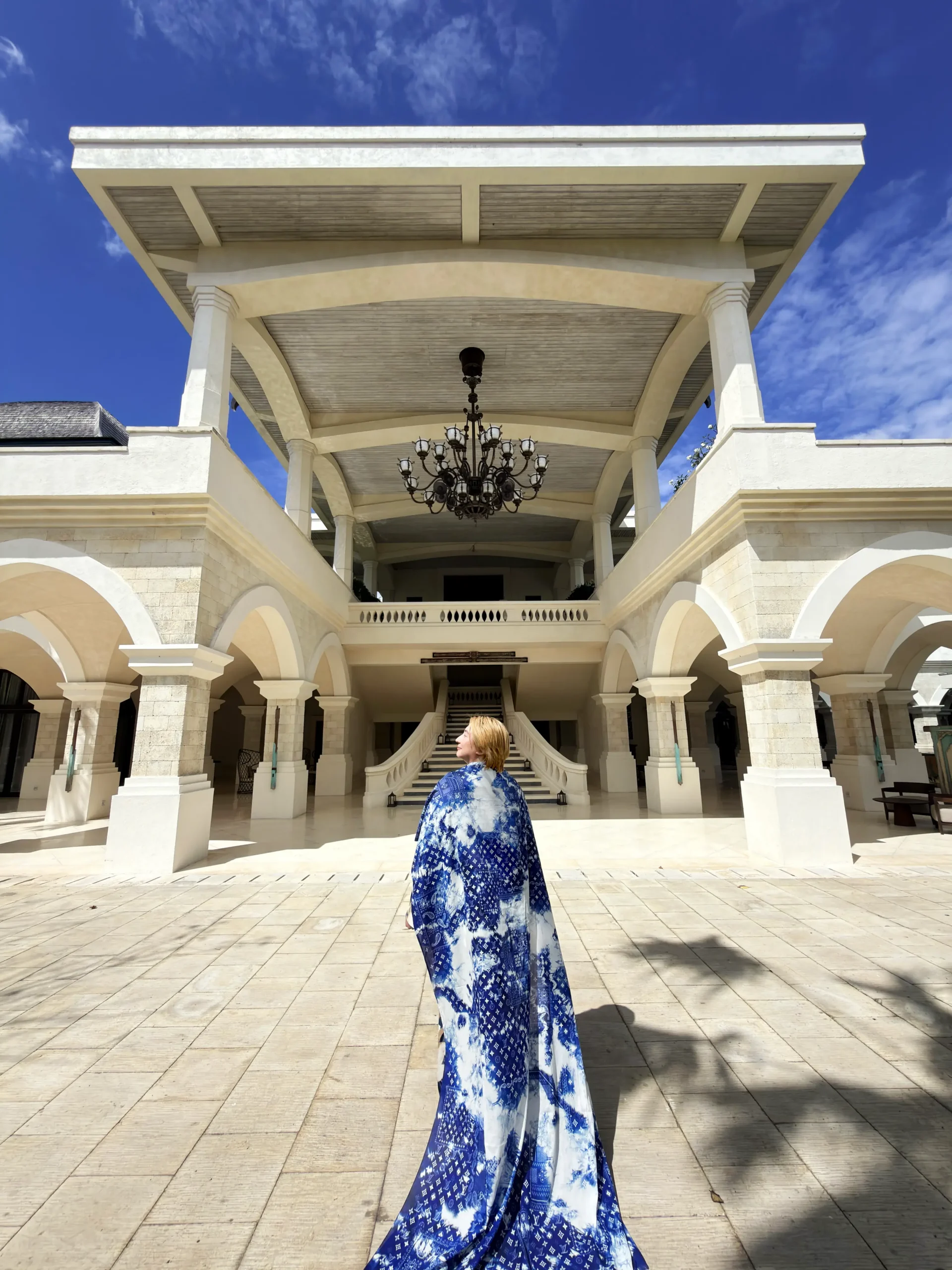 Stefano Malachi arriving in elegance, walking through the grand, majestic Hindu-Javanese water palace gates and architectural marvels of Jumeirah Bali.