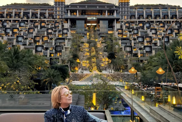 Stefano Malachi taking in the golden hour sunset views at The Apurva Kempinski Bali, framed by the resort's majestic cliffside luxury setting.