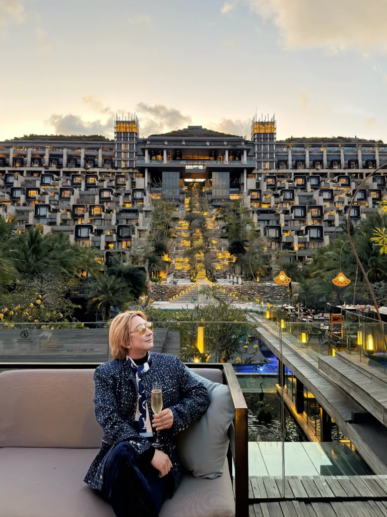 Stefano Malachi taking in the golden hour sunset views at The Apurva Kempinski Bali, framed by the resort's majestic cliffside luxury setting.