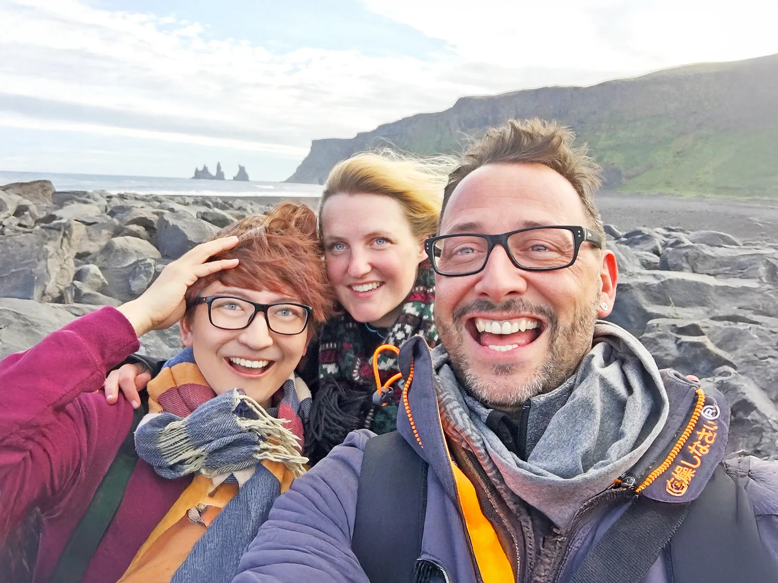 Stefano Malachi and friends smiling joyfully during their breathtaking first-time guided expedition on the majestic ice formations of Vatnajökull Glacier in Iceland, showcasing high-end adventure travel.